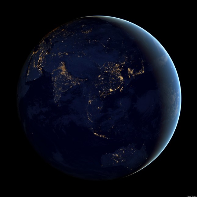 A NASA Earth Observatory handout of a composite image of Asia and Australia at night, assembled from data acquired by the Suomi NPP satellite in April and October 2012